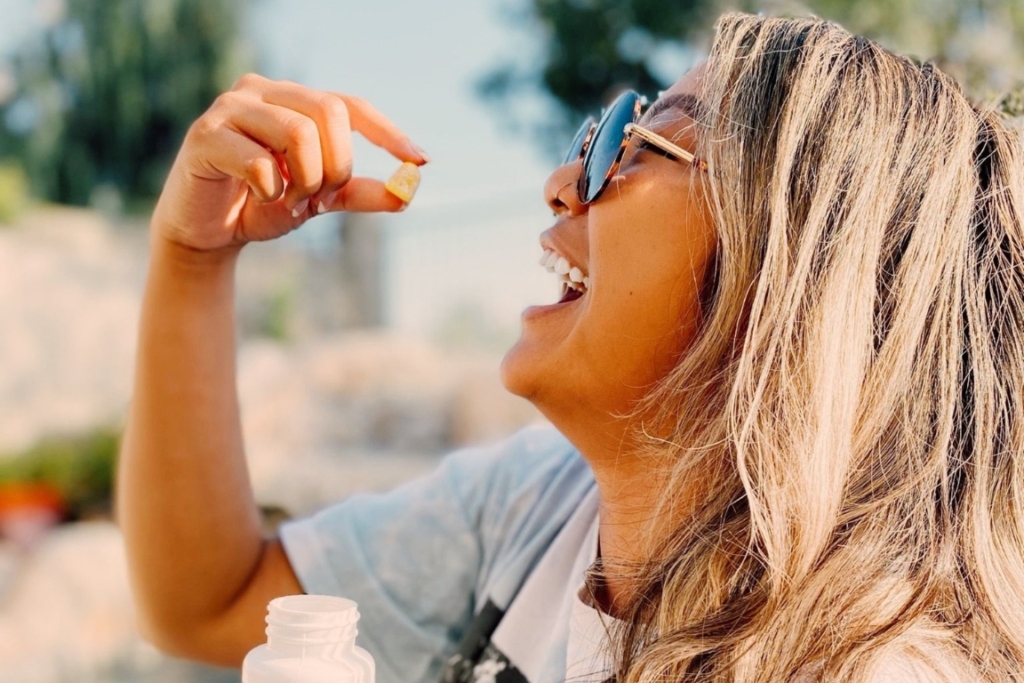 Woman enjoying CBD gummy