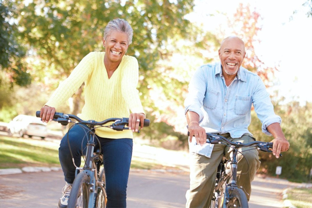Happy couple bicycling on beautiful day