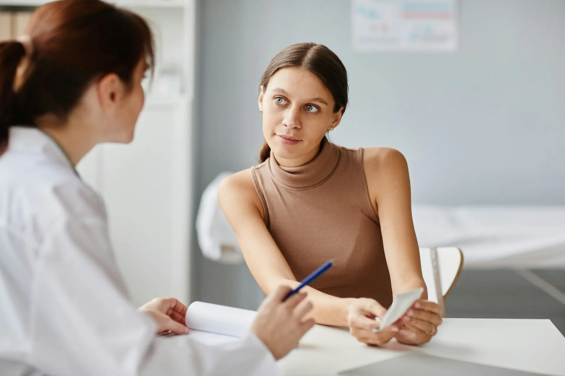 Patient discussing chronic headaches and migraine symptoms with a physician in Virginia Beach.